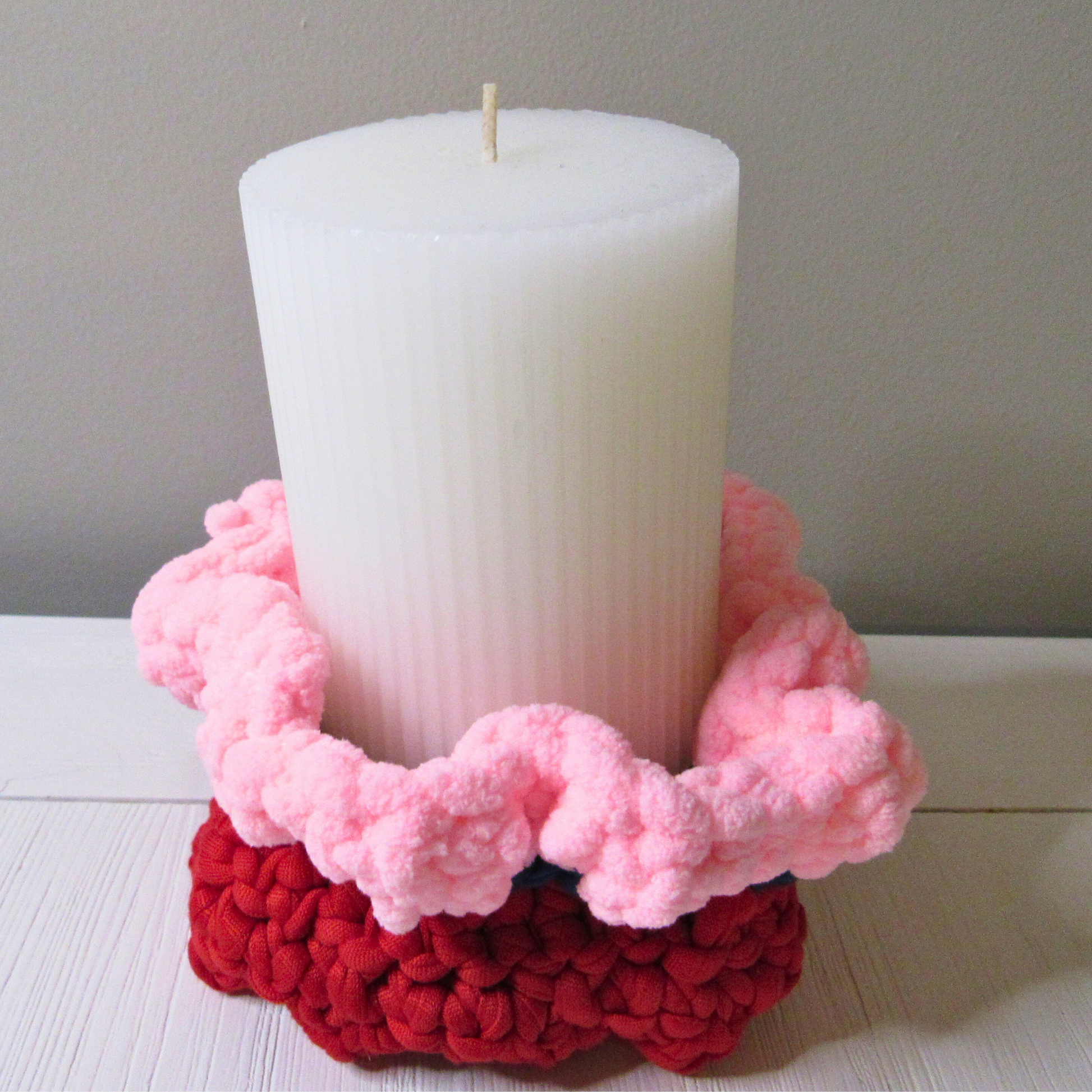 Cozy Mini Pedestal Functional Decorative Basket in pink holding a candle