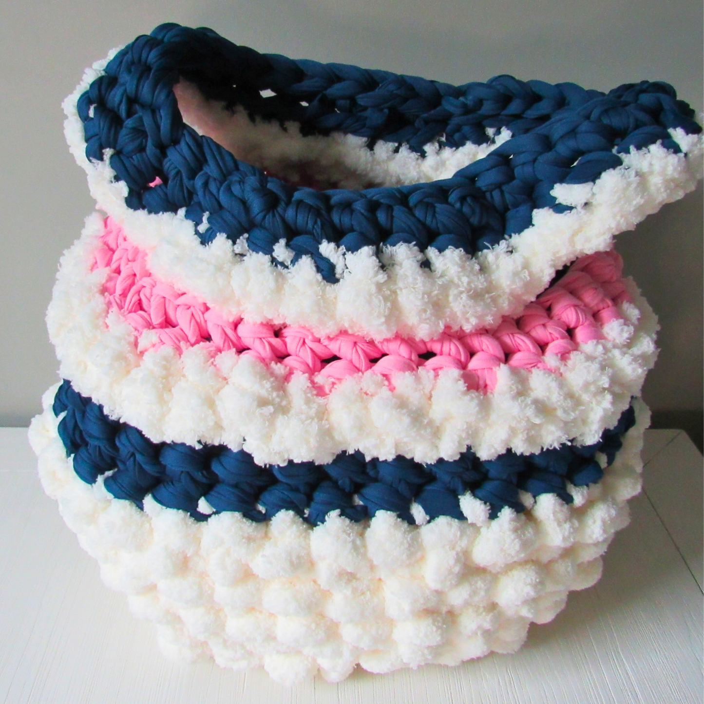 white crocheted storage basket